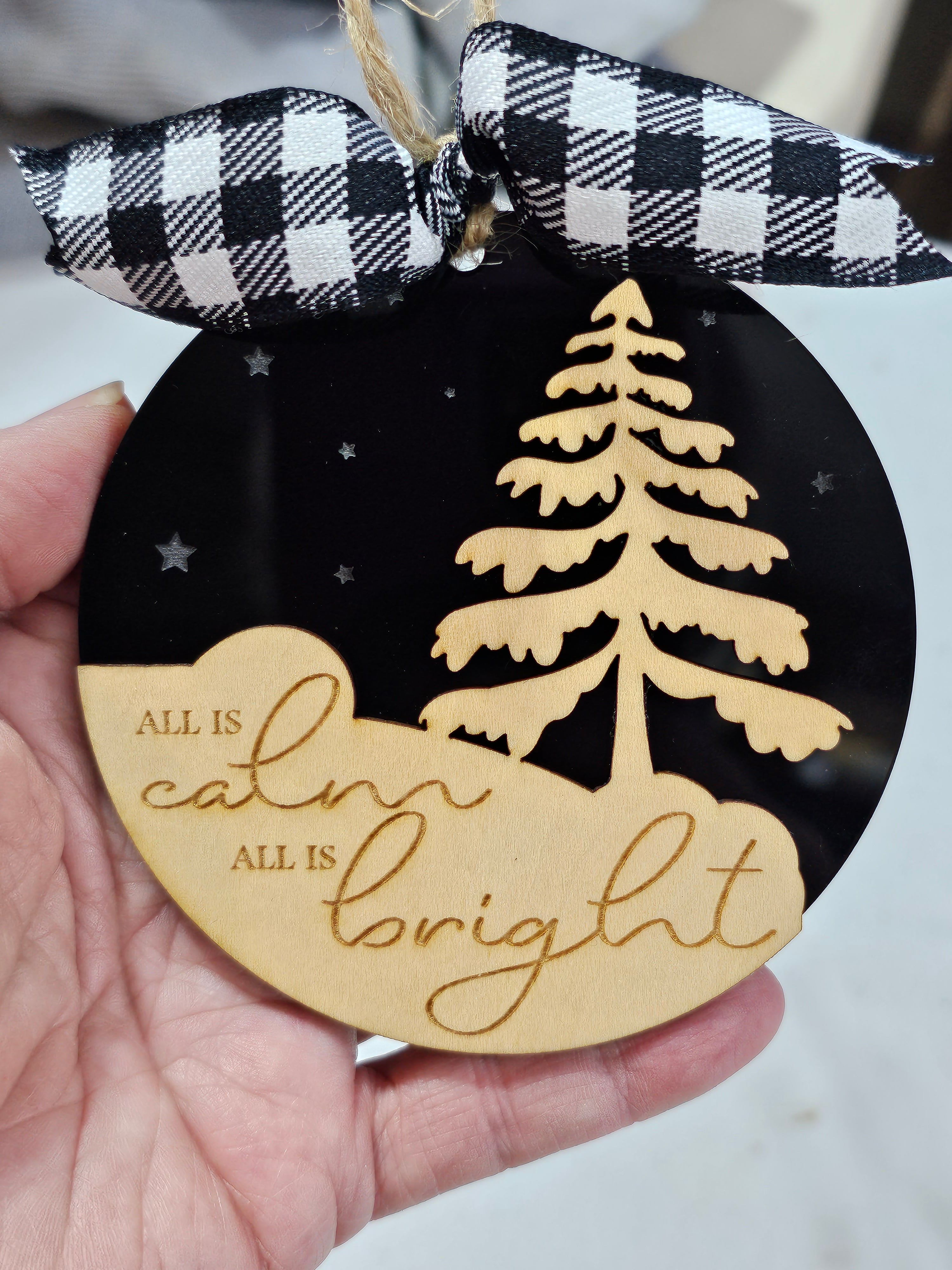 All is Calm All is Bright Christmas ornament with a black acrylic background and birch wood layered on top
