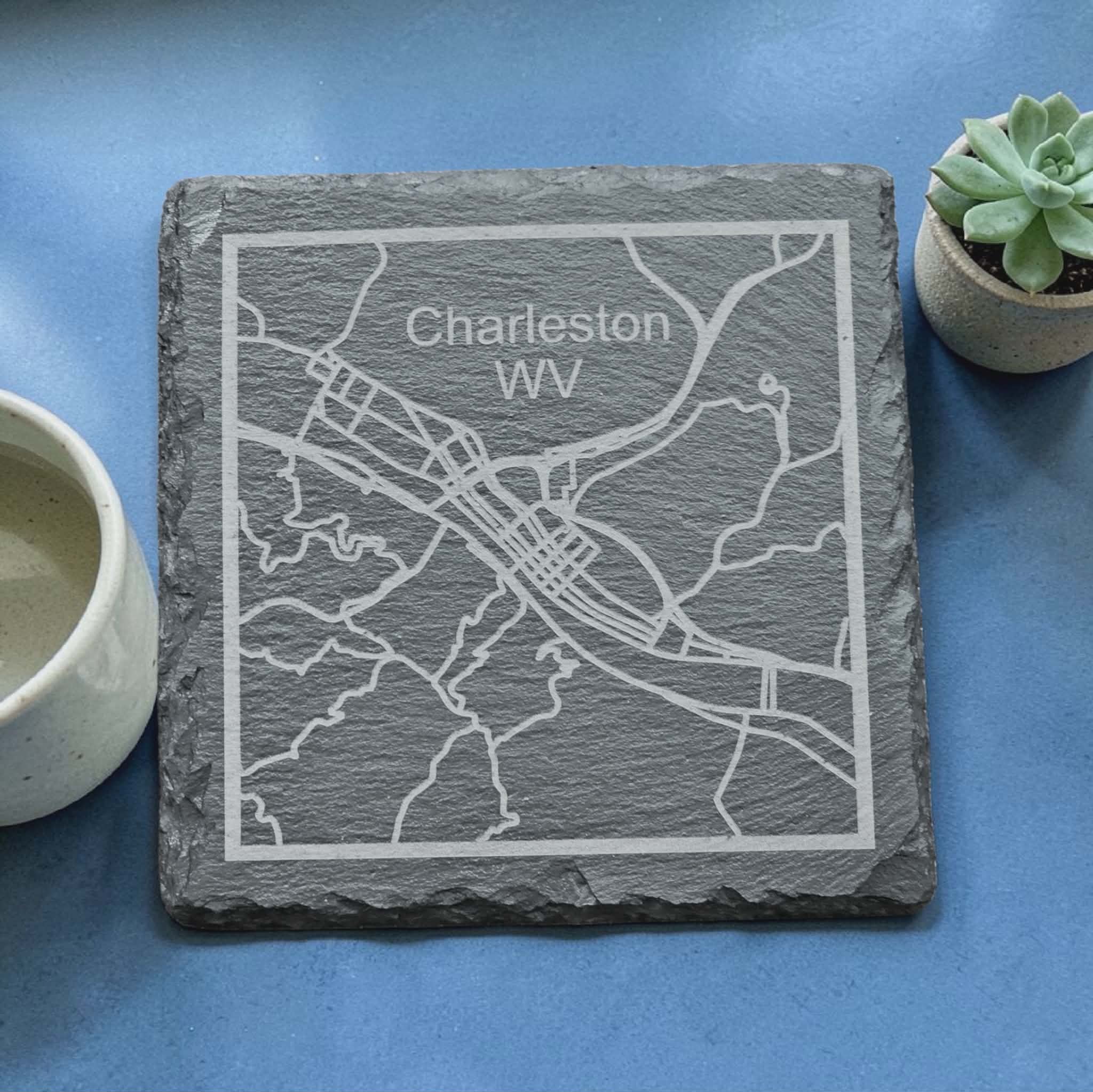Slate coaster engraved with Charleston, WV, on a blue background