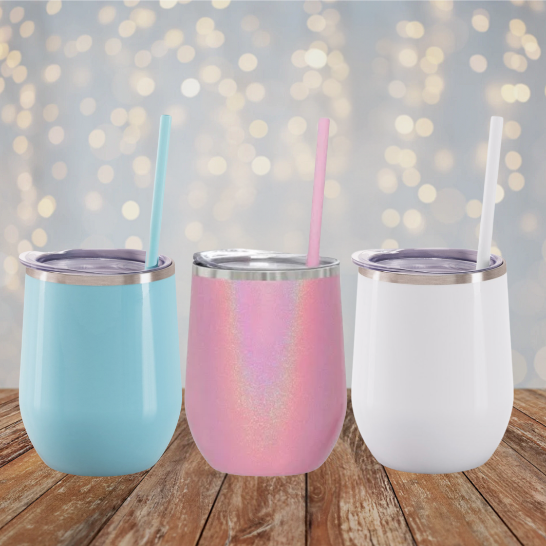 Photo of 3 tumblers with a lighted backdrop