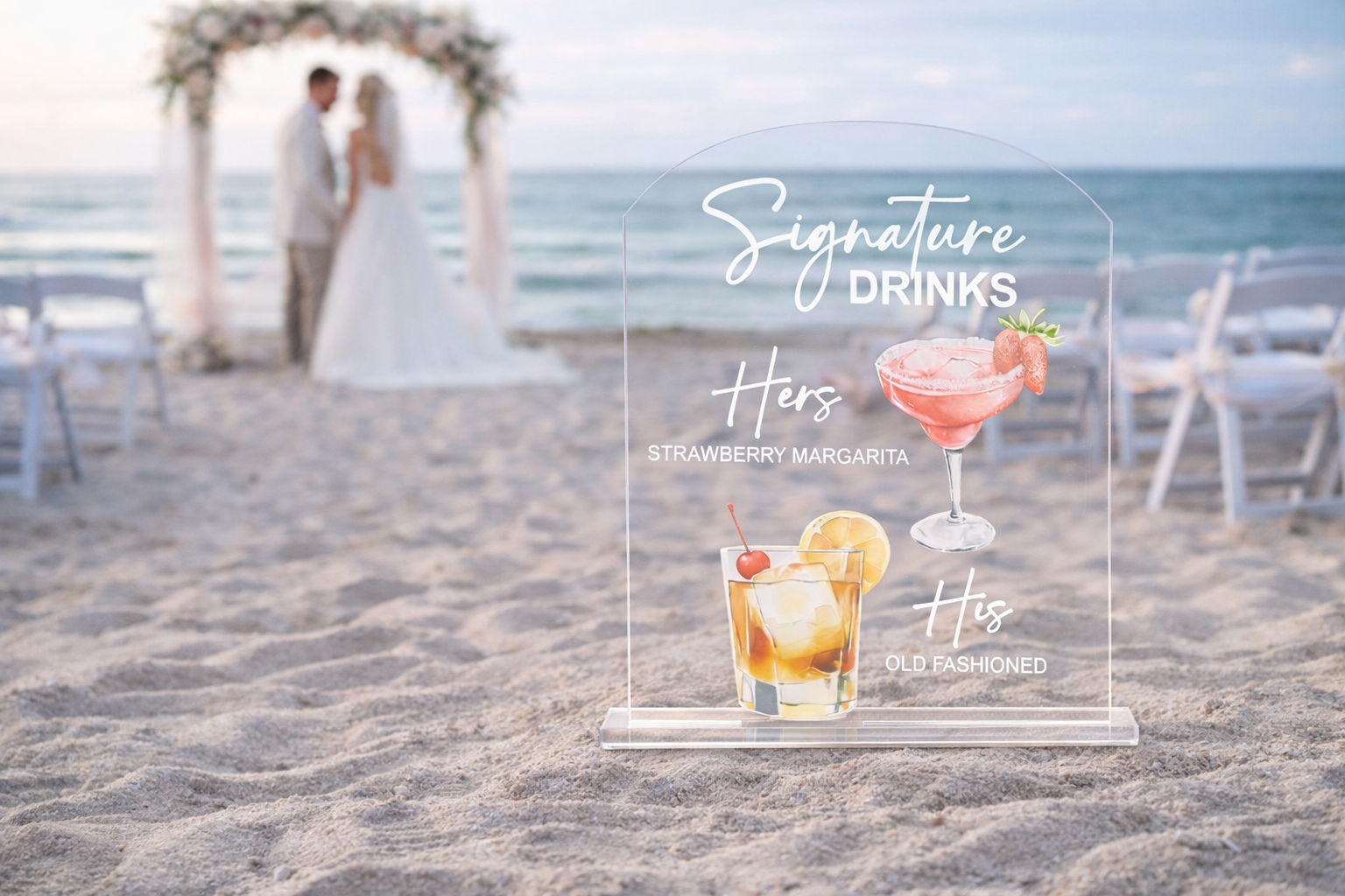 Acrylic sign with 'Signature Drinks' for a beach wedding, showing a strawberry margarita and Old Fashioned.