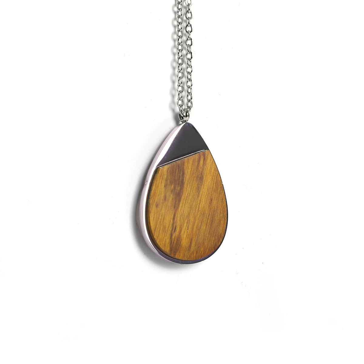 Teardrop-shaped pendant with Ironwood and silver accents on a white background