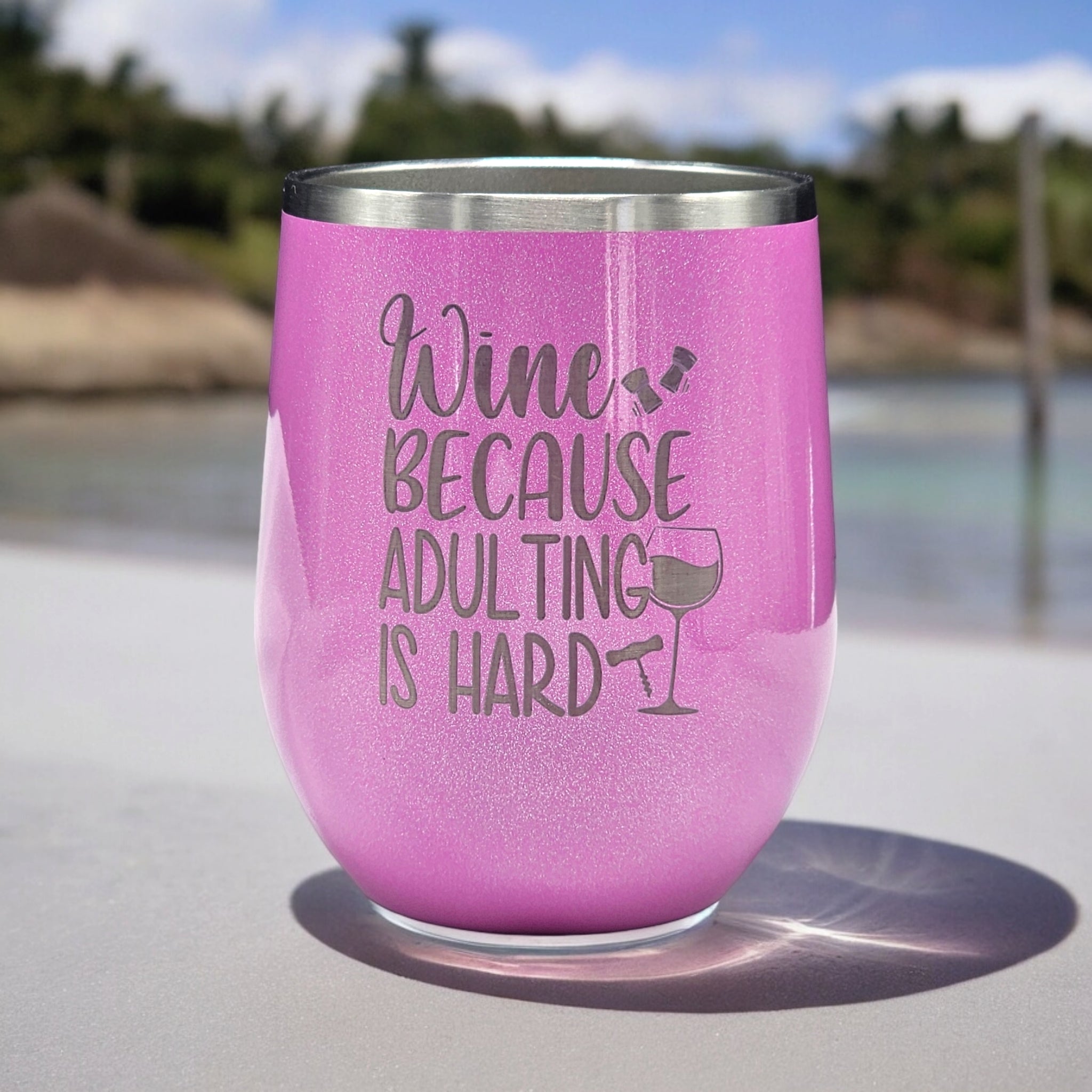 12 oz. wine tumbler with “Wine because adulting is hard” laser engraved graphic