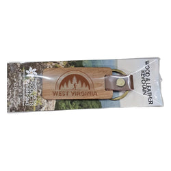Laser engraved wooden keychain with a leather bound keyring designed with the image of an arch with pine trees and a hiker underneath and the words West Virginia along the bottom.