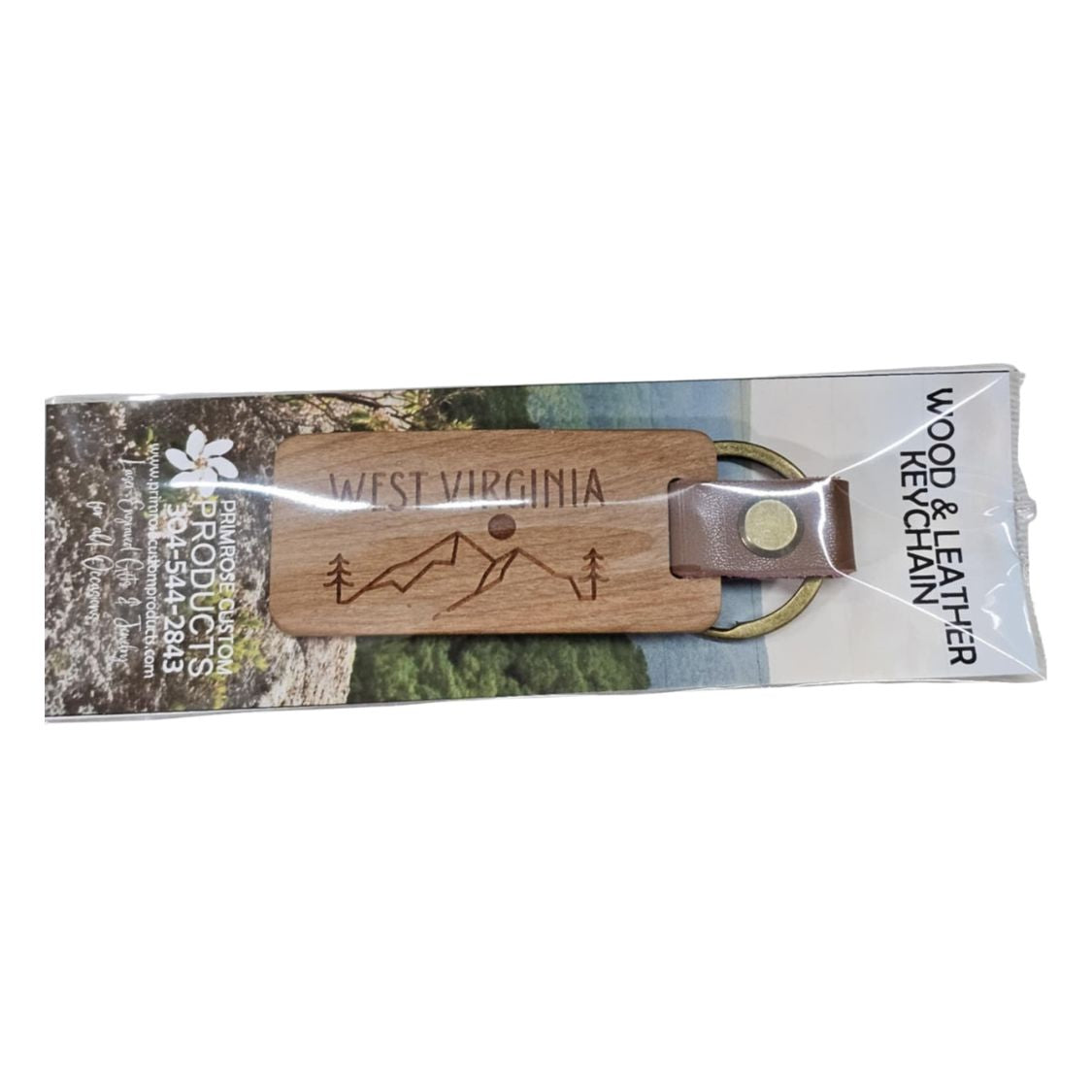 Laser engraved wooden keychain with a leather-bound keyring designed with a mountain line drawing and the words West Virginia