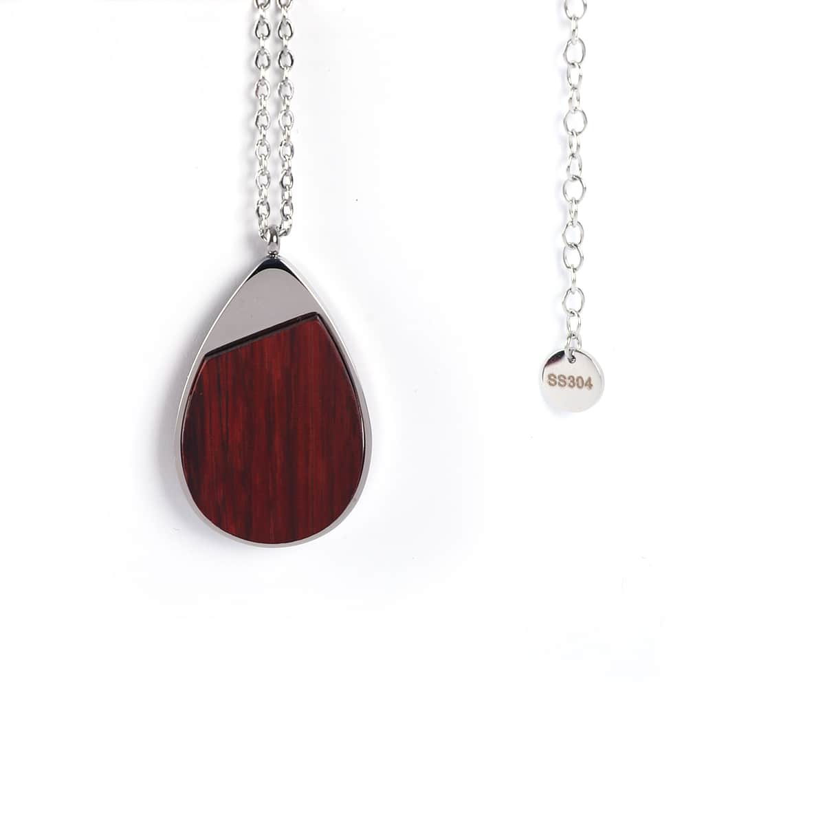 Teardrop-shaped pendant with Rosewood and silver design on a white background
